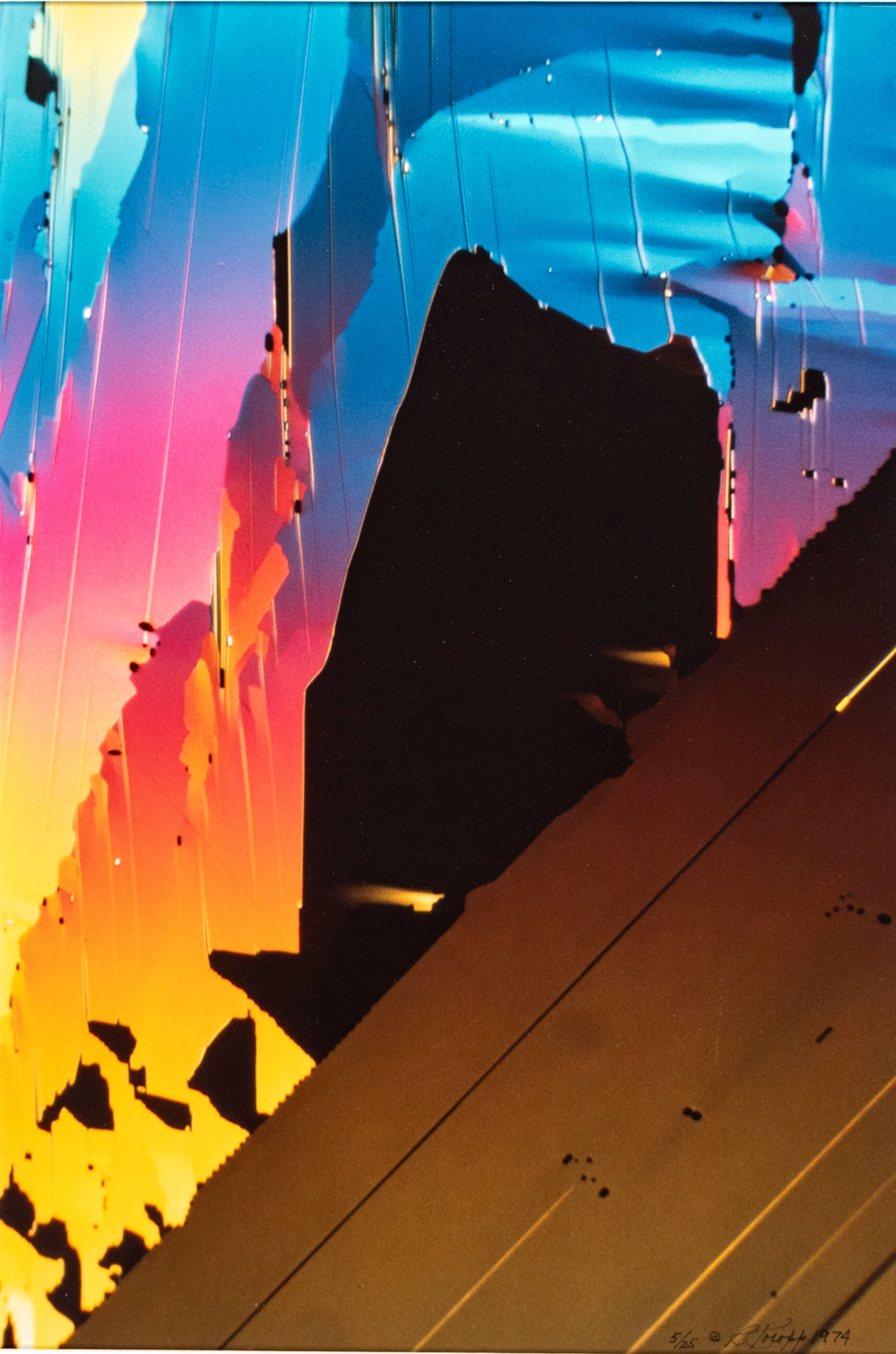 Highly colorful photograph of the side of a building with rainbow colors being reflected.